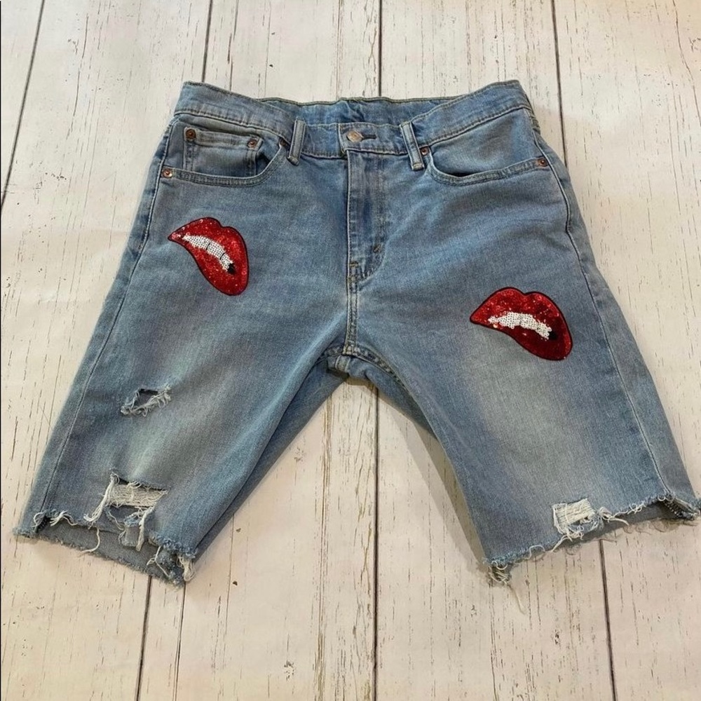 Vintage distressed Levi long shorts with Hot Lips frayed
